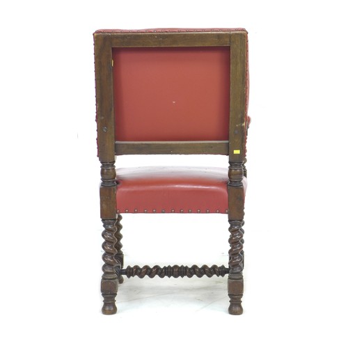 334 - A Victorian mahogany open armchair, in Jacobean style, later upholstered in red leather with padded ... 