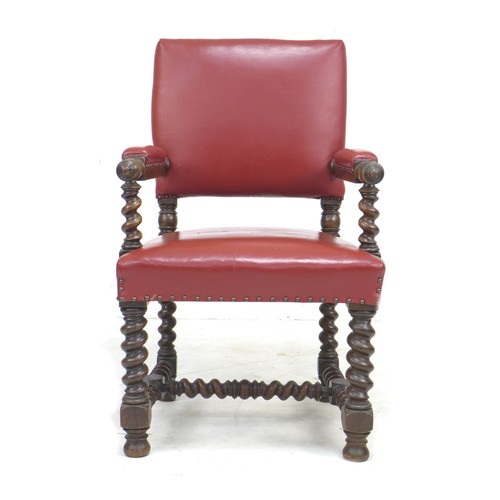 334 - A Victorian mahogany open armchair, in Jacobean style, later upholstered in red leather with padded ... 