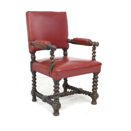 334 - A Victorian mahogany open armchair, in Jacobean style, later upholstered in red leather with padded ... 