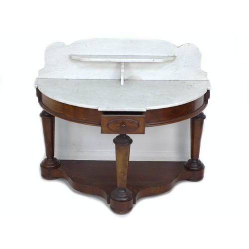 337 - A Victorian mahogany and white Carrara marble washstand, of demi lune form, the marble surface with ... 