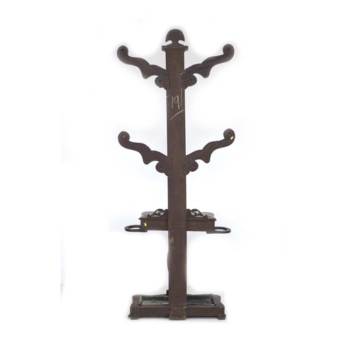 335 - A Victorian mahogany hall stand, the shaped upright with four arms and eight turned pegs, glove comp... 