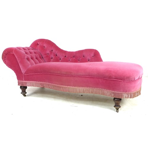 351 - A Victorian chaise longue, with shaped arm and scroll end, upholstered in pink buttoned velvet, rais... 