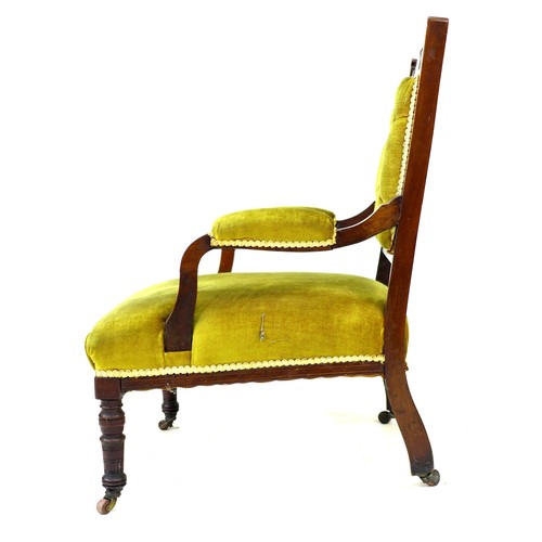 329 - A late Victorian open armchair, with carved and inlaid frame, upholstered in green gold velvet, padd... 