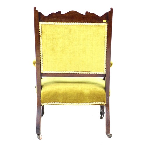 329 - A late Victorian open armchair, with carved and inlaid frame, upholstered in green gold velvet, padd... 