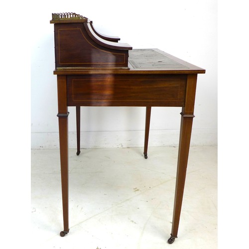 349 - An Edwardian mahogany and line inlaid lady's writing desk, brass gallery and shelf between two conca... 