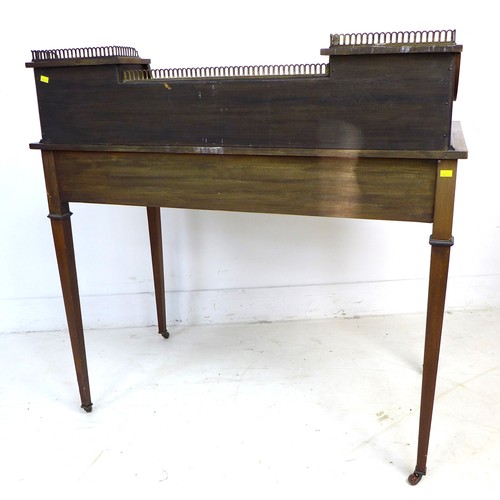 349 - An Edwardian mahogany and line inlaid lady's writing desk, brass gallery and shelf between two conca... 