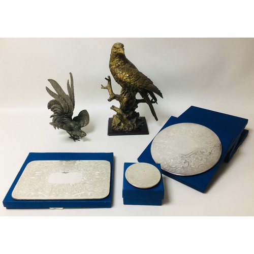 66 - A modern sculpture of an eagle, together with a silver plated metal sculpture of a fighting cock, an... 