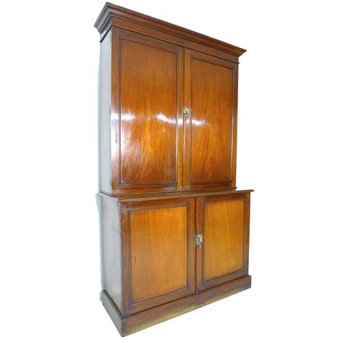 352 - A Victorian mahogany Estate cupboard, the upper section with twin doors opening to reveal an arrange... 