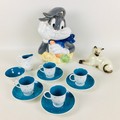 A Susie Cooper polka dot pattern part coffee set, with four coffee cans and saucers, a milk jug and ... 