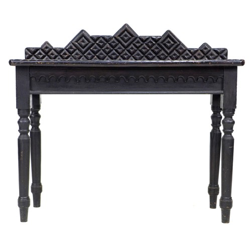 354 - An unusual 19th century ebonised oak side table, the surface and upstand applied with moulding cut i... 