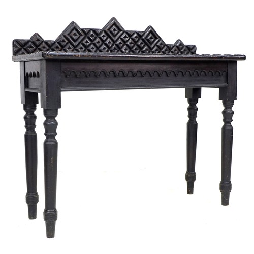 354 - An unusual 19th century ebonised oak side table, the surface and upstand applied with moulding cut i... 