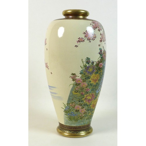 18 - A Japanese Satsuma vase, circa 1930, of shouldered ovoid form, decorated with a peacock standing on ... 