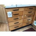 Shop cabinet of double sided drawers in oak.