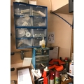 A shelf and cabinets of tools, screws etc.