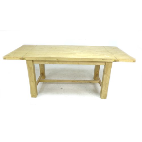 206 - A modern beech dining table and six chairs, rectangular surface with drop leaves, square section leg... 