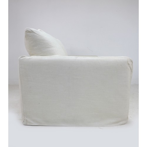 273 - A modern three seater sofa, upholstered in white cotton, 208 by 101 by 90cm high.