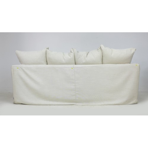 273 - A modern three seater sofa, upholstered in white cotton, 208 by 101 by 90cm high.