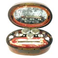 A French burr walnut Gentleman's dressing case, circa 1810, of oval form with four fitted lift out t... 