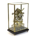 A Trigona brass skeleton clock in the form of a windmill, mid 20th century, with 8 day fusee movemen... 