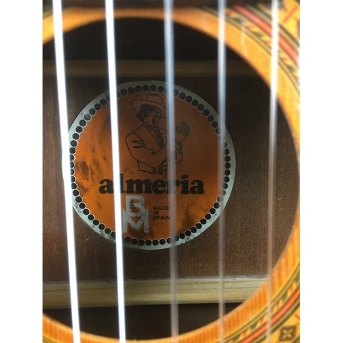 125 - A Spanish made classical guitar by Almeria, label to interior.