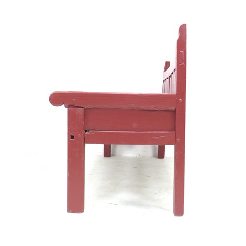 338 - A Chinese style red painted pine bench, late 19th / early 20th century, with low six panel back, sha... 