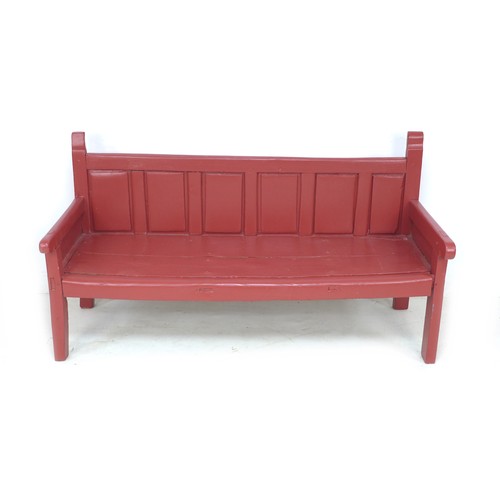 338 - A Chinese style red painted pine bench, late 19th / early 20th century, with low six panel back, sha... 