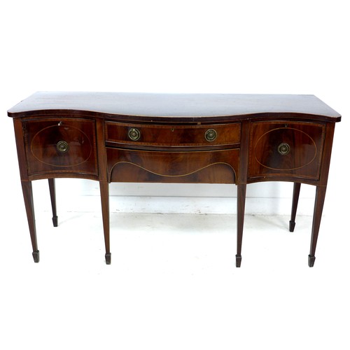 333 - A George III mahogany sideboard, serpentine fronted, crossbanded and inlaid, two cupboards flanking ... 