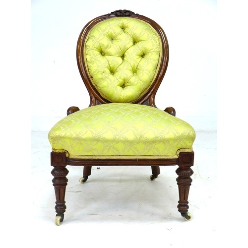 291 - A Victorian mahogany spoon back nursing chair, with floral carved and moulded frame, upholstered in ... 