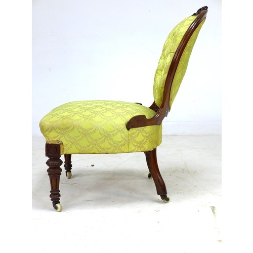 291 - A Victorian mahogany spoon back nursing chair, with floral carved and moulded frame, upholstered in ... 