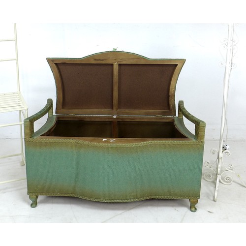 212 - A green painted wicker Albion Woven Furniture bedroom seat, with two handles, curved sides, and padd... 