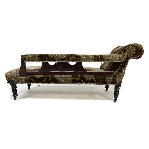 300 - A late Victorian mahogany chaise longue, with carved frame, turned legs and castors, upholstered in ... 