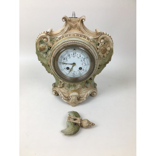 149 - A group of three mantel clocks, comprising a Victorian slate clock, 25 by 35cm, a Victorian white al... 