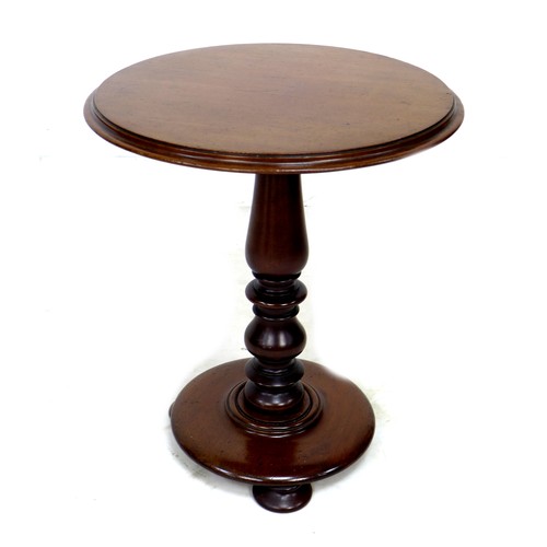 230 - A Victorian mahogany occasional table, circular surface with moulded edge, raised on a turned column... 