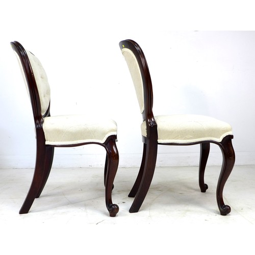 231 - A pair of Victorian mahogany bedroom chairs, with moulded frames, cabriole front legs, modern cream ... 