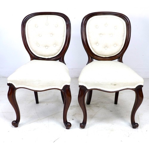 231 - A pair of Victorian mahogany bedroom chairs, with moulded frames, cabriole front legs, modern cream ... 