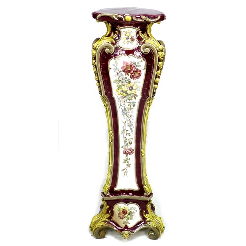 310 - A Victorian ceramic pedestal, in Rococo style with three bombe sides and moulded foliate decoration,... 