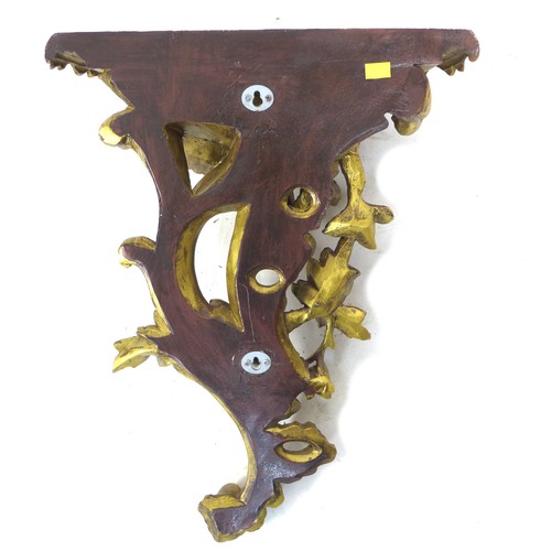 233 - A pair of modern reproduction Rococo style wall brackets, with demi lune surfaces and scroll form bo... 