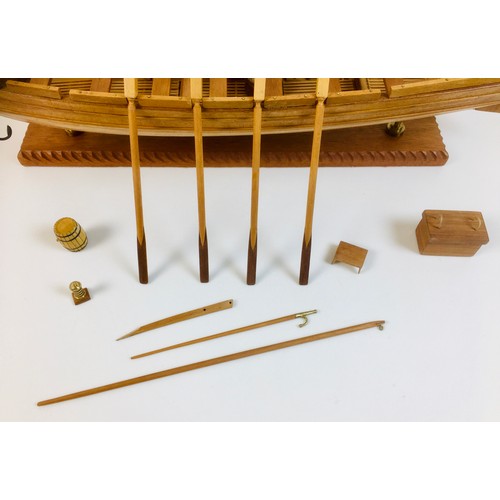 161 - A scratch built wooden model of a large sailing rowboat, with provision for up to sixteen oars, but ... 