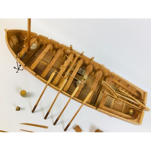 161 - A scratch built wooden model of a large sailing rowboat, with provision for up to sixteen oars, but ... 