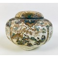 A Japanese early 20th century Satsuma pottery potpourri, vase and pierced cover, decorated with rese... 
