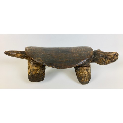 99 - A group of five tribal carved wooden items, comprising a small Ethiopian tripod stool, with circular... 