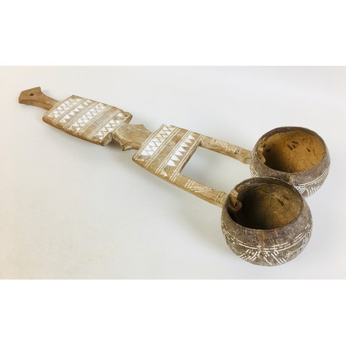 104 - A collection of eight African tribal carved wooden spoons, comprising a double gourd ladle, with lim... 