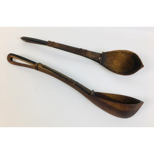 104 - A collection of eight African tribal carved wooden spoons, comprising a double gourd ladle, with lim... 