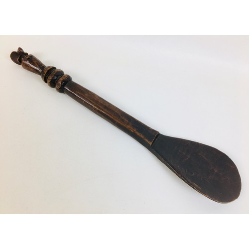 104 - A collection of eight African tribal carved wooden spoons, comprising a double gourd ladle, with lim... 