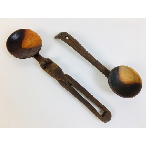 104 - A collection of eight African tribal carved wooden spoons, comprising a double gourd ladle, with lim... 