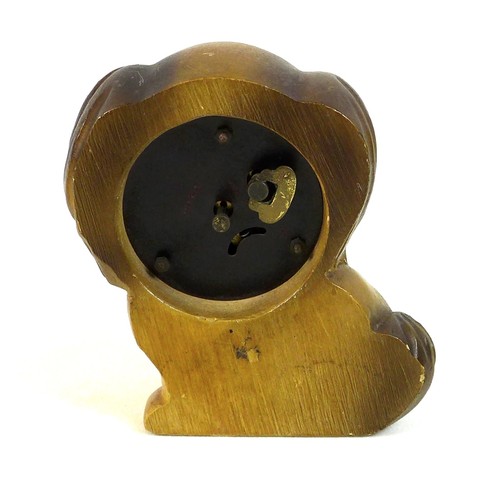 147 - An Oswald rotating eyes clock, in the form of a Pekingese dog, stamped Germany to the back and with ... 