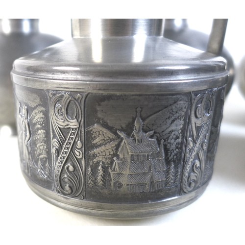 71 - A group of six pieces of Norwegian pewter, comprising a candlestick, unmarked, a lidded ewer, stampe... 