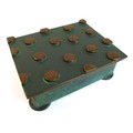 An Art Deco Austrian green patinated bronze box, the hinged lid cast with raised polished circles, r... 