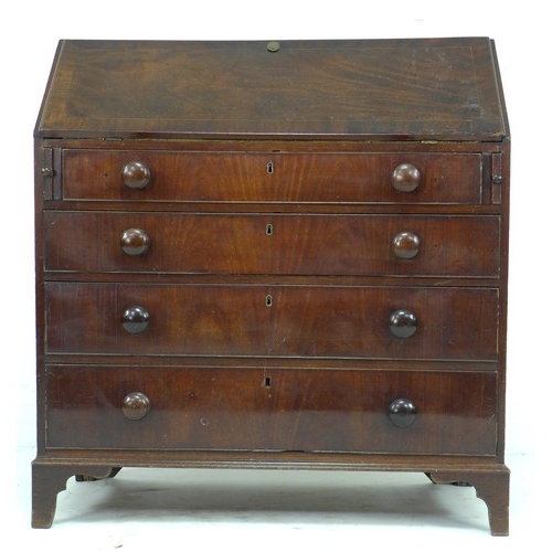 304 - An early 19th century mahogany bureau, fall front with fitted interior, over four graduating drawers... 