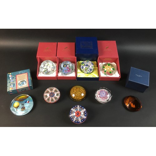 51 - A group of ten paperweights, comprising a Millefiore limited edition Pheonix Paperweights Ltd weight... 